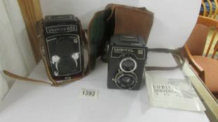 A vintage Yashica 635 camera and a Lubitel Universal 166 camera.