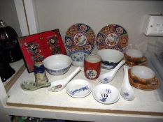 A selection of Oriental pottery including tea bowls, plates, spoons etc