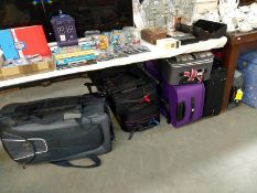 A good selection of suitcases/travel cases including Mickey Mouse