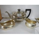 A three piece silver tea set, Birmingham, Barker Bros, approximately 29 ounces.