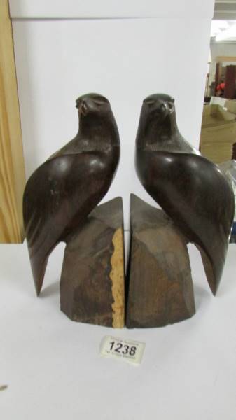 A pair of carved hard wood bird bookends.