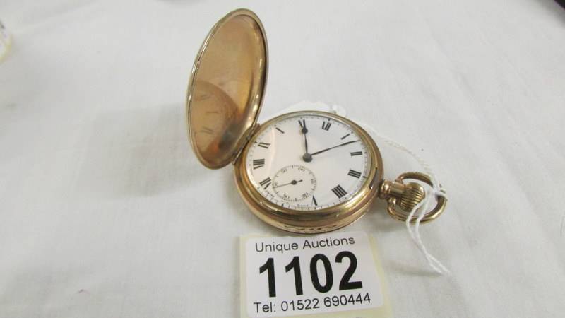 A gold plated full hunter pocket watch marked Dennison Watch Case Co., Ltd., In working order.