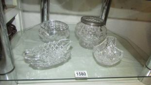 Two cut glass rose bowls and two other glass items.