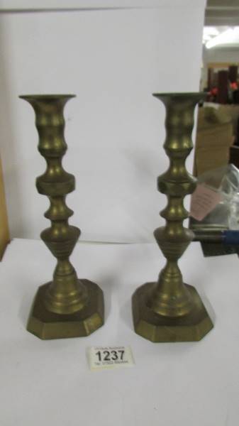 A pair of Victorian brass candlesticks.