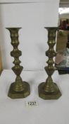 A pair of Victorian brass candlesticks.