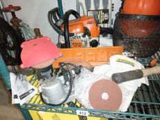 A chainsaw, sharpener, protective head gear, box of chisels & level etc. COLLECT ONLY