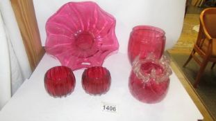 A Cranberry glass bowl and four other cranberry glass items.