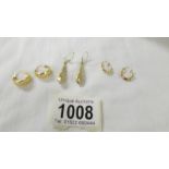 Three pairs of 9ct gold earrings, 3.4 grams.