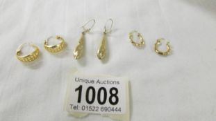 Three pairs of 9ct gold earrings, 3.4 grams.