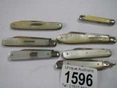 A collection of 5 silver and mother of pearl fruit/penknives and two others.