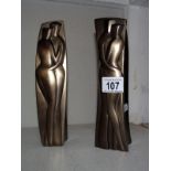 A pair of modern candle holders