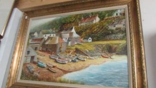 A gilt framed oil on canvas coastal scene signed Keith J Ward, COLLECT ONLY.