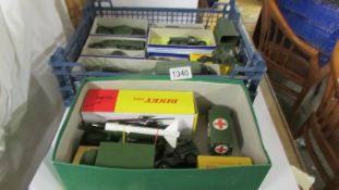 Thirteen Dinky military vehicles, twelve in reproduction boxes.