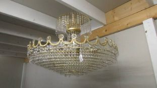 A large glass and gilt chandelier. COLLECT ONLY.