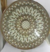 A large middle eastern ceramic dish, 42 cm diameter.