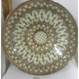 A large middle eastern ceramic dish, 42 cm diameter.