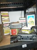 A large 1950's push button (maybe Ford) radio & an original Volvo 8 stereo 8 track/radio with a