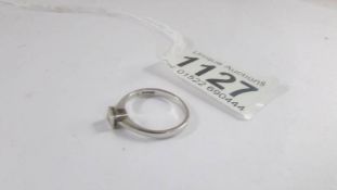 A 9ct white gold diamond solitaire ring, size K, 2 grams.