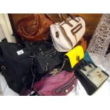 A quantity of bags, mainly by Balenciaga Paris, includes a holdall by Carven, Paris, Mulberry