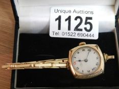 A 9ct gold ladies wrist watch on gold bracelet marked J Kar? Liverpool.