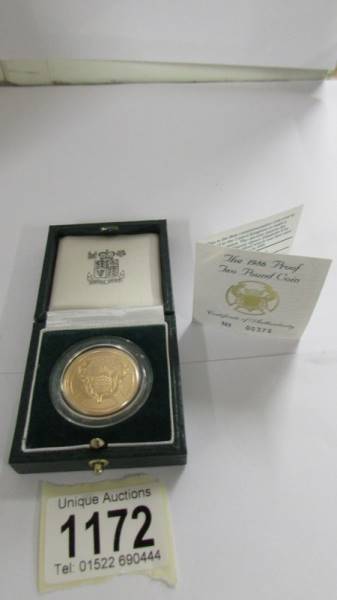 A 22ct gold 1986 £2 coin, No,00375.