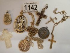 A mixed lot of crosses, St. Christopher's etc., including two silver.