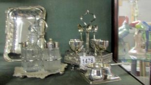 A silver plated condiment set, egg cup stand, tea strainer and basket.