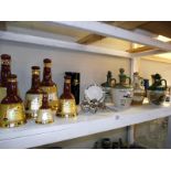 A quantity of Wade bells in various sizes and Yorkshire liqueur and Irish whisky stoneware ewes, all