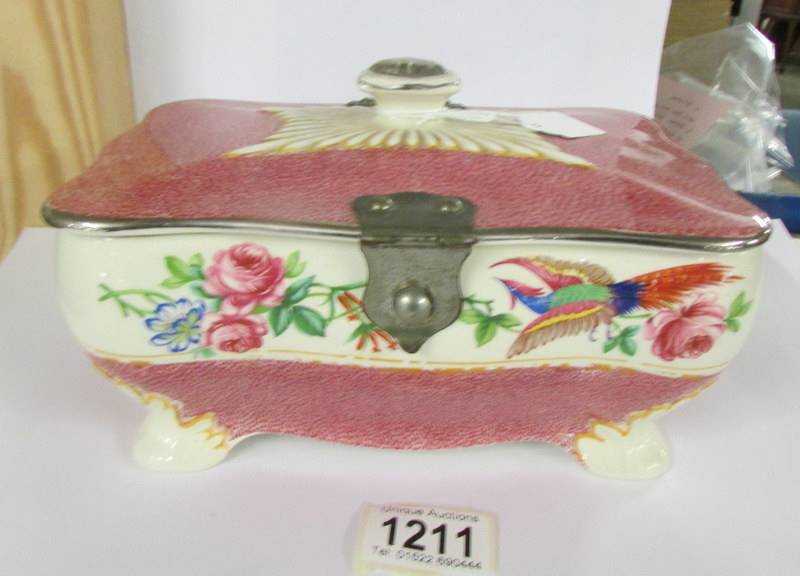 An English ceramic bird decorated box with plated fittings, 21 x 14 x 10 cm.