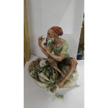 A porcelain figure of a fisherman.