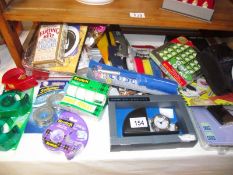 A mixed lot of new items including sellotape, gas lighters, travel clock, photo frame etc