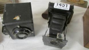 A Kodak Special Brownie camera and another Kodak camera.