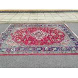 A large Persian carpet 100% wool pile (240cm x 335cm), COLLECT ONLY