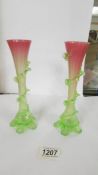 A pair of 19th century green in to pink glass spill vases (20cm) (one has chip to bottom of ridge).