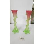 A pair of 19th century green in to pink glass spill vases (20cm) (one has chip to bottom of ridge).