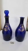 Two 19th century Bristol blue glass decanters (one missing stopper).