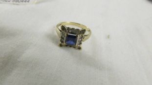 A square sapphire and diamond ring in yellow gold, size N half.