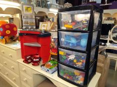 A 4 drawer storage chest of children's toys, wooden stool, play kitchen, Cars lamp etc. COLLECT