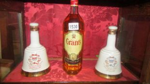 Two Wade commemorative bells with contents and a bottle of Grant's whisky, COLLECT ONLY.