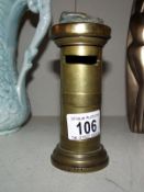 An old brass moneybox in the form of a pillar box