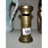 An old brass moneybox in the form of a pillar box