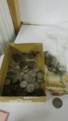 A mixed lot of coins including some silver, 1942 US half dollar etc.,
