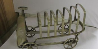 A rare art deco silver plated toast rack in the form of a lorry.