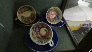 Three Aynsley cobalt blue tea cups and saucers.