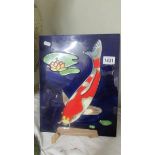 A ceramic wall plaque depicting koi carp. 36 x 28 cm.