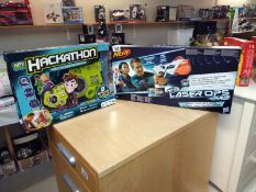 A sealed boxed Nerf laser ops pro and spy code Hackathon (opened)