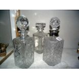 Three heavy cut glass decanters