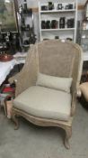 A high backed shabby chic chair with cane back. COLLECT ONLY.