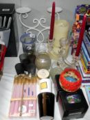 A selection of candle holders and candles, including candelabra, tea light stand etc
