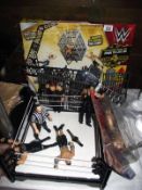 WWE wrestling ring and figures, box is a/f and completeness unknown, includes a pack of other